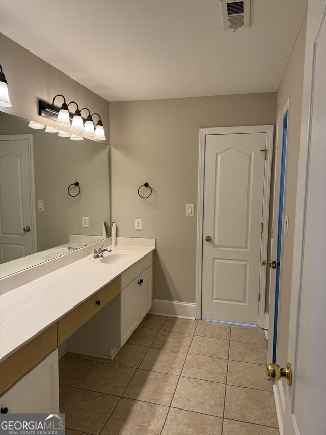 135 Danube Trl, Stockbridge, GA 30281 - bathroom featuring tile patterned flooring, vanity, visible vents, and baseboards