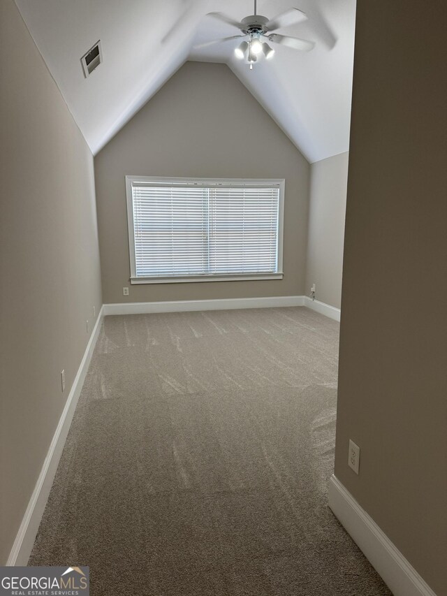 135 Danube Trl, Stockbridge, GA 30281 - bonus room featuring baseboards, carpet floors, visible vents, lofted ceiling, and ceiling fan