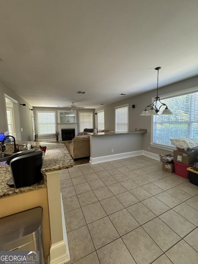 135 Danube Trl, Stockbridge, GA 30281 - living area with plenty of natural light, visible vents, and light tile patterned flooring