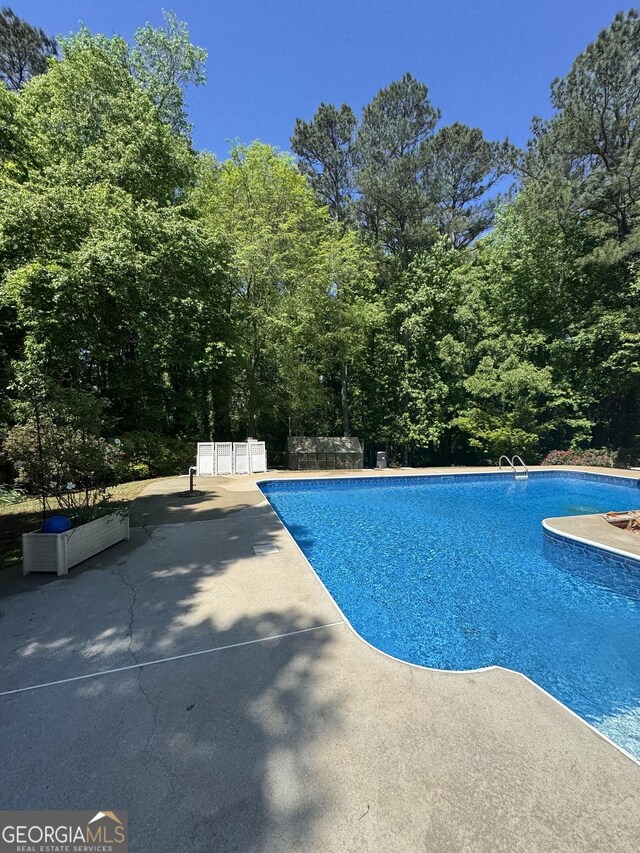 135 Danube Trl, Stockbridge, GA 30281 - outdoor pool with a patio area