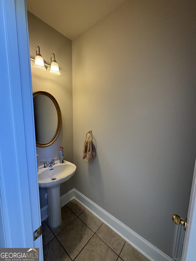 135 Danube Trl, Stockbridge, GA 30281 - bathroom with baseboards and tile patterned flooring