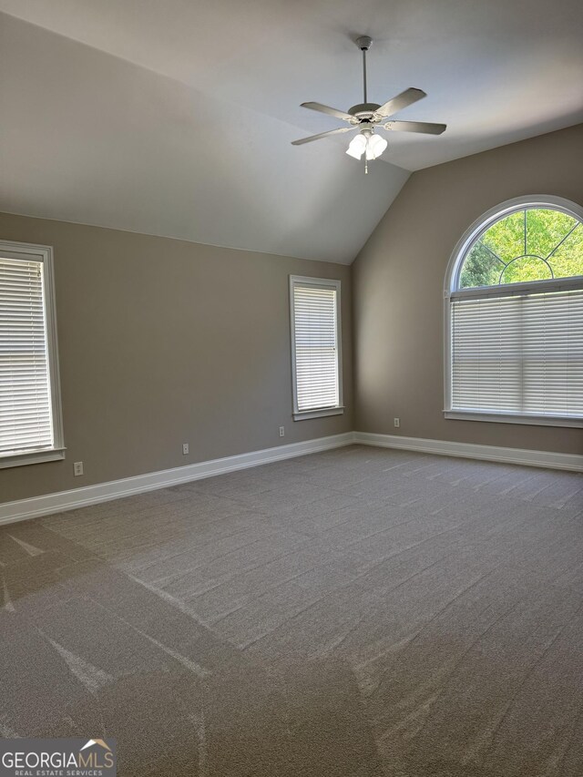 135 Danube Trl, Stockbridge, GA 30281 - spare room with ceiling fan, carpet, baseboards, and lofted ceiling