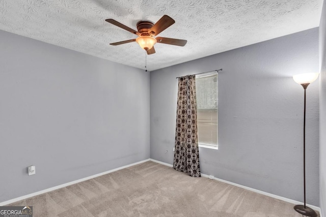 2998 Kenville Ln, Decatur, GA 30034 - spare room featuring baseboards, carpet, a textured ceiling, and a ceiling fan