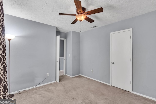 2998 Kenville Ln, Decatur, GA 30034 - unfurnished bedroom featuring a textured ceiling, baseboards, visible vents, and carpet floors