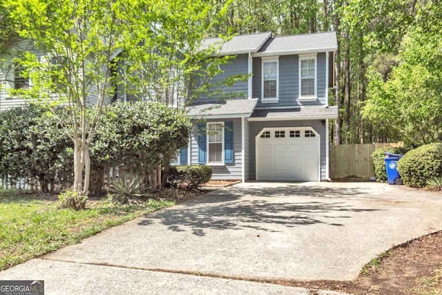 2998 Kenville Ln, Decatur, GA 30034 - view of front of home with fence, a garage, and concrete driveway