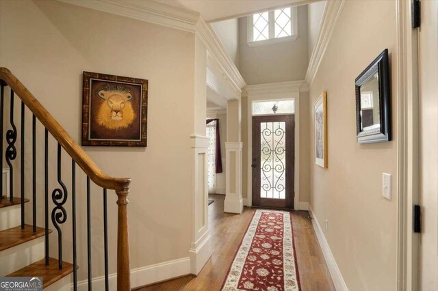 1786 Cambridge Sq, Watkinsville, GA 30677 - entrance foyer featuring crown molding, wood finished floors, baseboards, and stairs