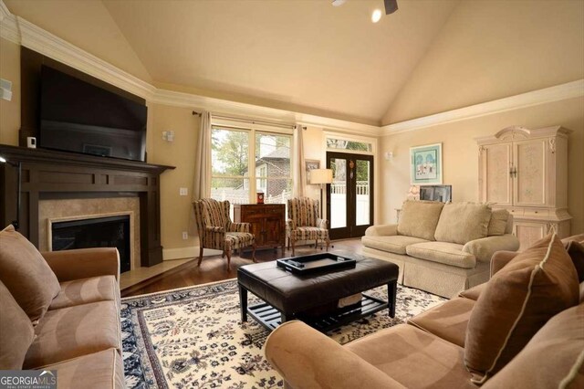 1786 Cambridge Sq, Watkinsville, GA 30677 - living room with baseboards, a high end fireplace, wood finished floors, french doors, and high vaulted ceiling