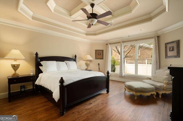 1786 Cambridge Sq, Watkinsville, GA 30677 - bedroom featuring a tray ceiling, crown molding, wood finished floors, and a ceiling fan