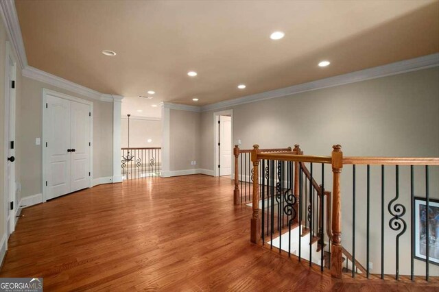 1786 Cambridge Sq, Watkinsville, GA 30677 - interior space with wood finished floors, ornamental molding, an upstairs landing, and recessed lighting