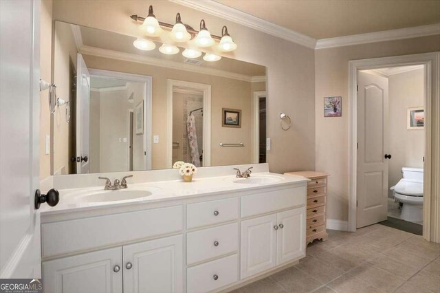 1786 Cambridge Sq, Watkinsville, GA 30677 - full bathroom with tile patterned flooring, ornamental molding, a sink, and toilet