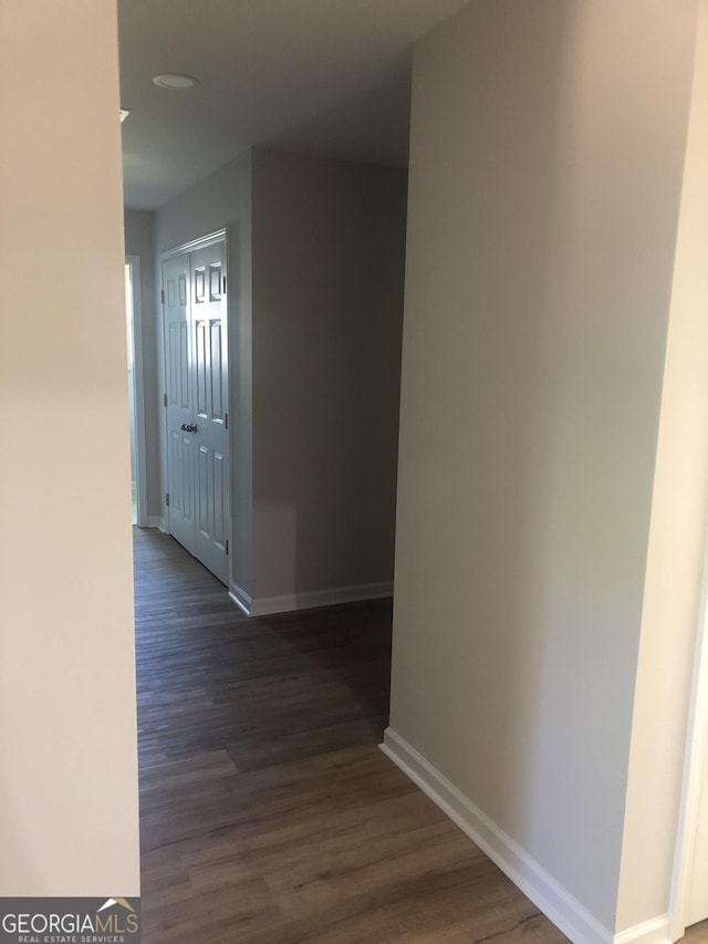 2303 12th Ave, Valley, AL 36854 - hallway featuring dark wood-style flooring and baseboards