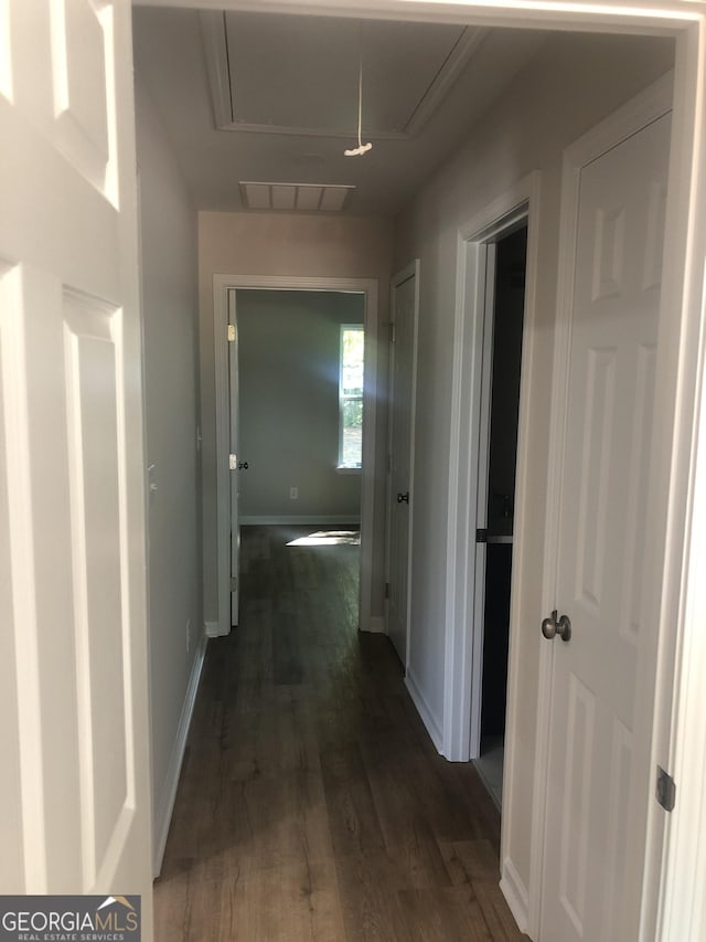 2303 12th Ave, Valley, AL 36854 - corridor featuring baseboards, dark wood-style flooring, visible vents, and attic access