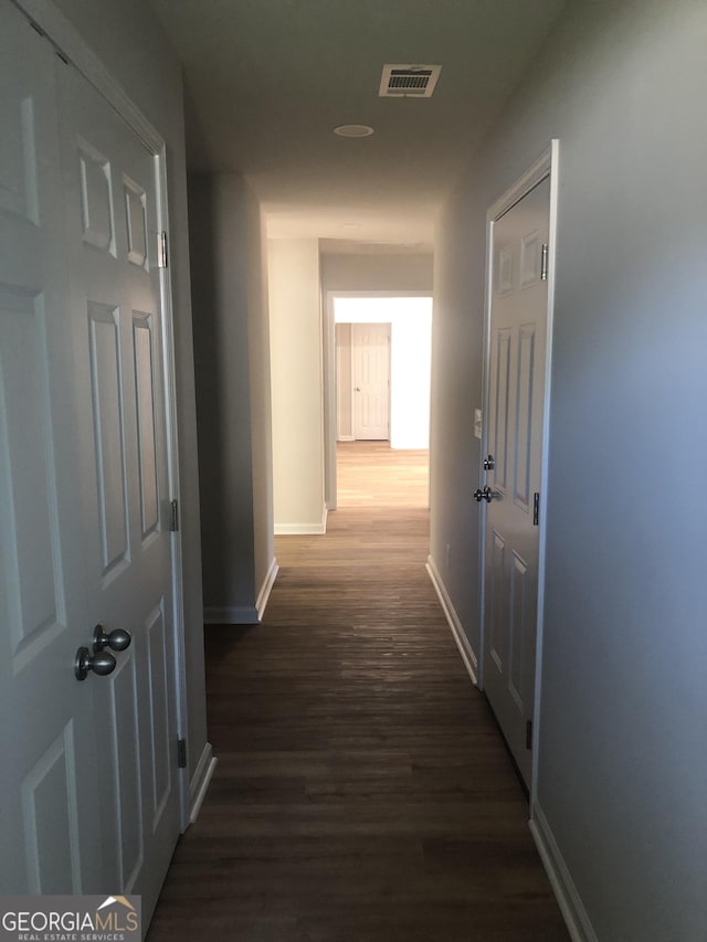2303 12th Ave, Valley, AL 36854 - corridor with dark wood-type flooring, visible vents, and baseboards