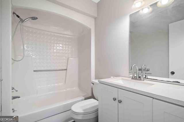 bathroom featuring shower / washtub combination, toilet, and vanity