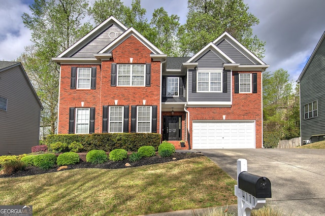 view of front of home with a front yard, brick siding, driveway, and an attached garage