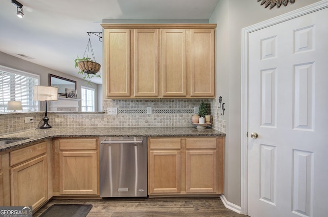 kitchen featuring dark stone counters, tasteful backsplash, wood finished floors, and light brown cabinets