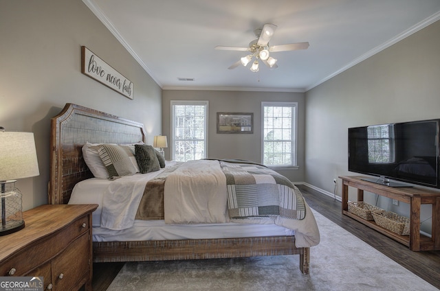 bedroom with ceiling fan, baseboards, ornamental molding, and wood finished floors