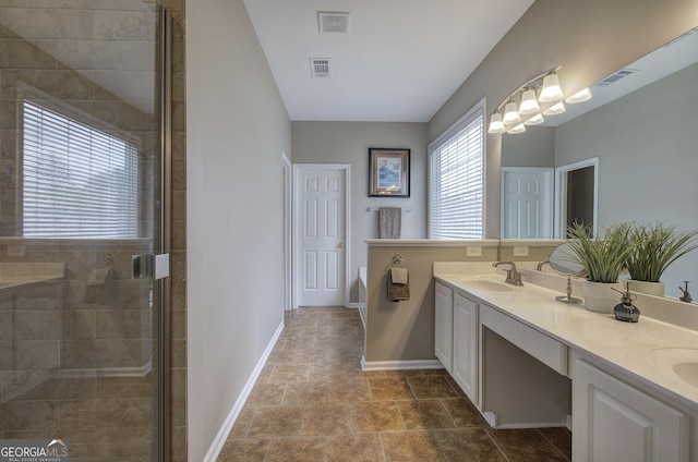 full bathroom featuring visible vents, a sink, and a stall shower