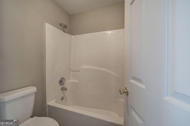 full bathroom with washtub / shower combination and toilet