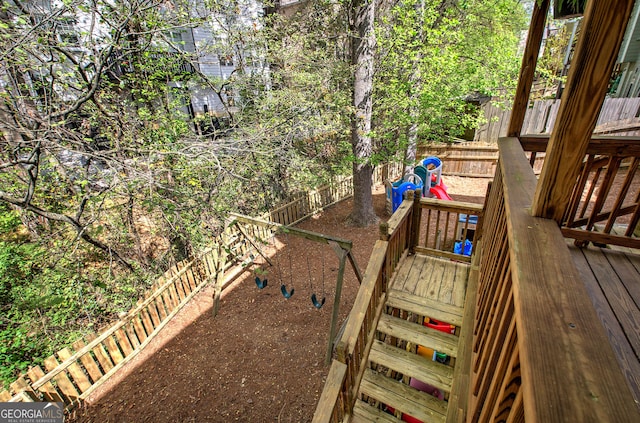 exterior space featuring a fenced backyard and a playground