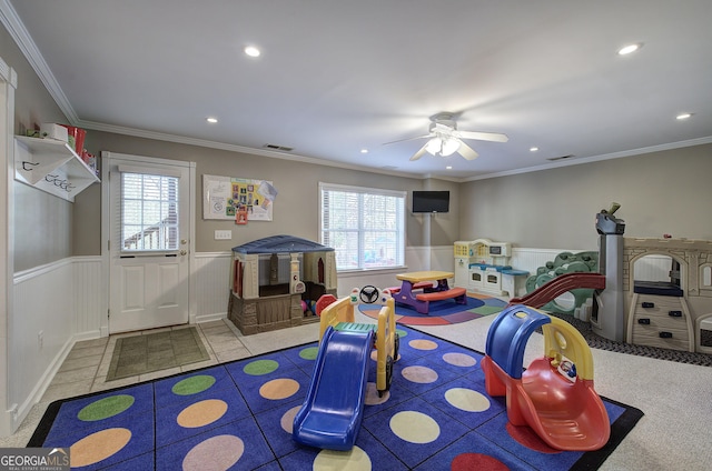 game room with a ceiling fan, recessed lighting, wainscoting, and a wealth of natural light