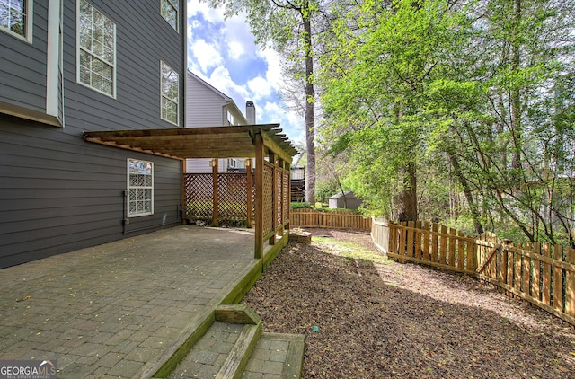 view of yard featuring a pergola, a patio, and fence