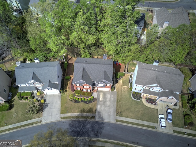 birds eye view of property with a residential view