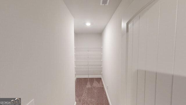 interior space with visible vents and carpet