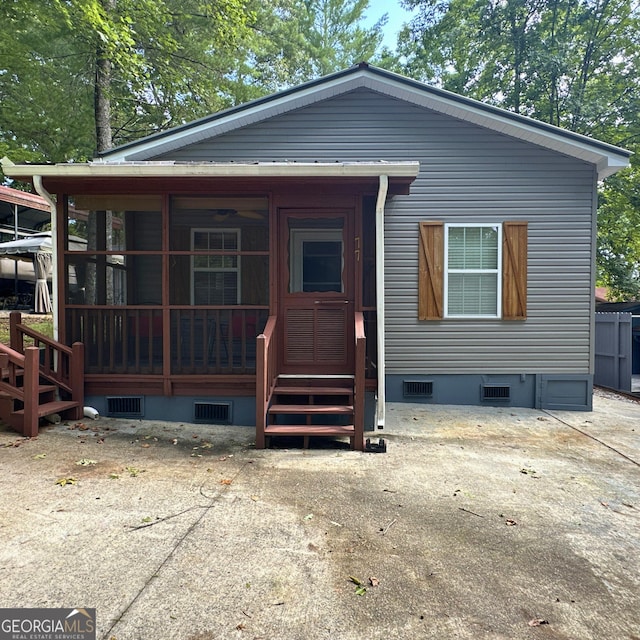 view of front of home featuring crawl space