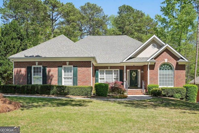 2545 Amberbrook Ln, Grayson, GA 30017 - ranch-style house with brick siding, a front lawn, and roof with shingles