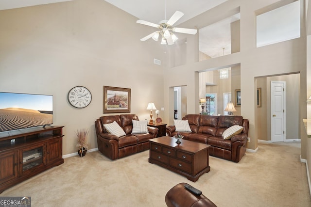 2545 Amberbrook Ln, Grayson, GA 30017 - living area with light carpet, baseboards, visible vents, and a towering ceiling