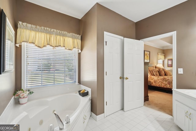 2545 Amberbrook Ln, Grayson, GA 30017 - ensuite bathroom featuring baseboards, a tub with jets, vanity, ensuite bath, and tile patterned flooring