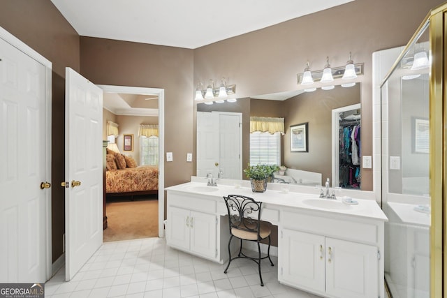 2545 Amberbrook Ln, Grayson, GA 30017 - ensuite bathroom with tile patterned flooring, double vanity, a sink, and a healthy amount of sunlight