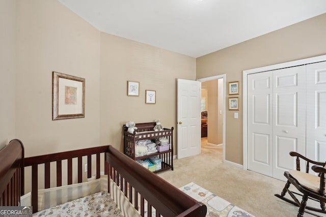 2545 Amberbrook Ln, Grayson, GA 30017 - bedroom featuring a closet, light colored carpet, and baseboards