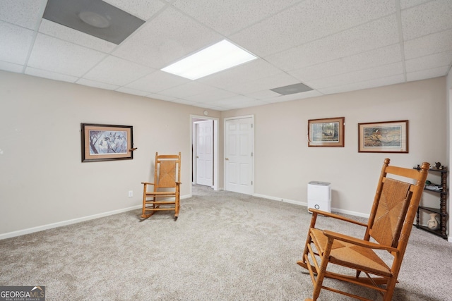 2545 Amberbrook Ln, Grayson, GA 30017 - living area featuring carpet flooring, baseboards, and a drop ceiling