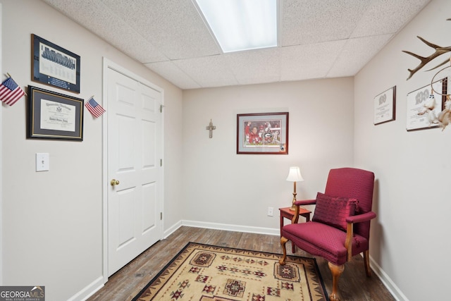 2545 Amberbrook Ln, Grayson, GA 30017 - sitting room with dark wood-type flooring, baseboards, and a paneled ceiling