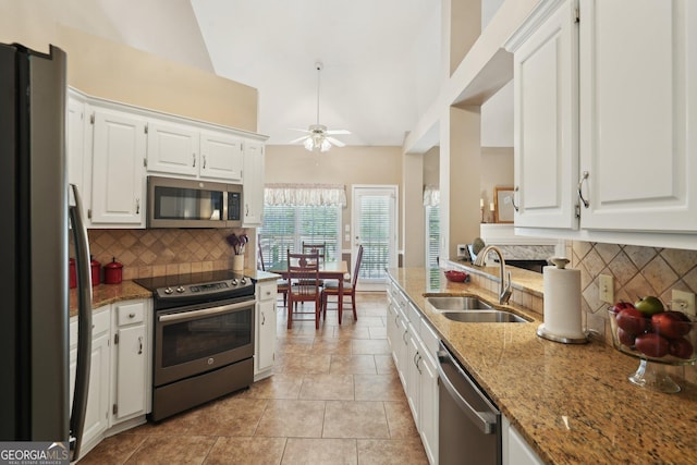 2545 Amberbrook Ln, Grayson, GA 30017 - kitchen featuring a sink, decorative backsplash, white cabinetry, and stainless steel appliances
