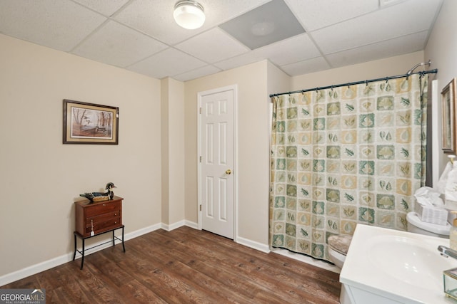2545 Amberbrook Ln, Grayson, GA 30017 - full bathroom featuring a drop ceiling, baseboards, and wood finished floors