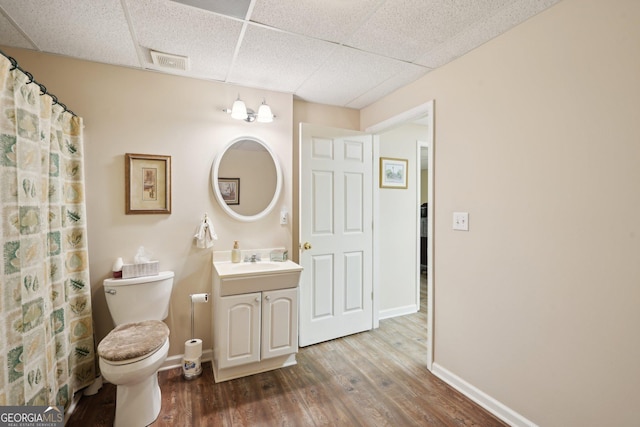 2545 Amberbrook Ln, Grayson, GA 30017 - full bathroom with toilet, a paneled ceiling, wood finished floors, and baseboards