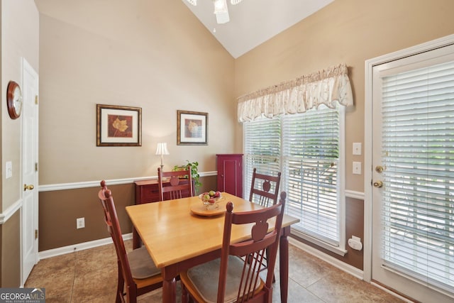 2545 Amberbrook Ln, Grayson, GA 30017 - dining area with ceiling fan, light tile patterned flooring, baseboards, and lofted ceiling