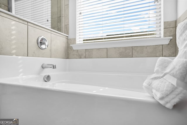 bathroom featuring a garden tub