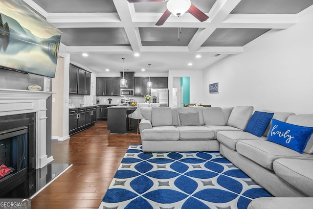 living room featuring ceiling fan, beamed ceiling, coffered ceiling, dark wood-style floors, and recessed lighting