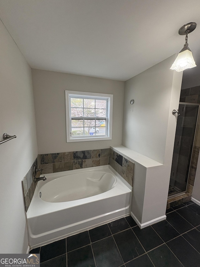 bathroom with a bath, tile patterned floors, and a shower stall