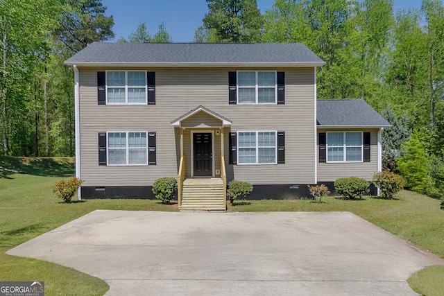 colonial home with a front yard
