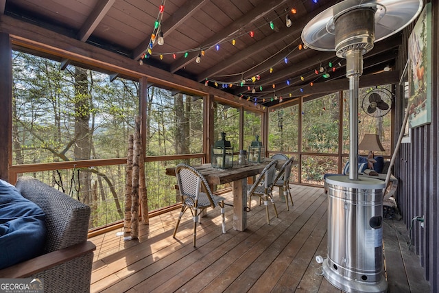 sunroom with beamed ceiling