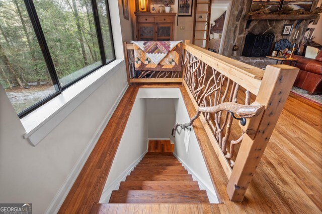 426 Crow Creek Rd, Lakemont, GA 30552 - stairs featuring wood finished floors and baseboards