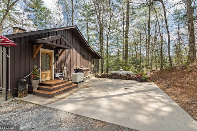 426 Crow Creek Rd, Lakemont, GA 30552 - view of property exterior with a chimney and a patio