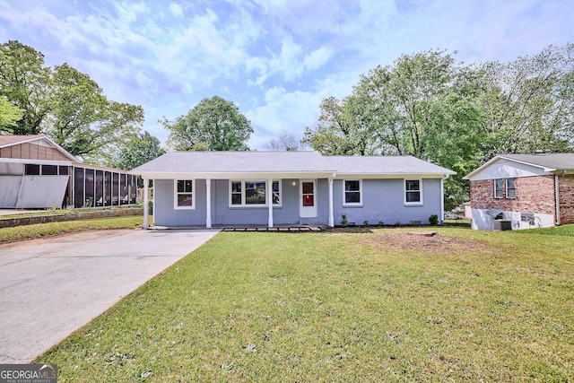 ranch-style house with a front yard and driveway