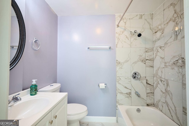 bathroom featuring toilet, vanity, baseboards, and shower / washtub combination
