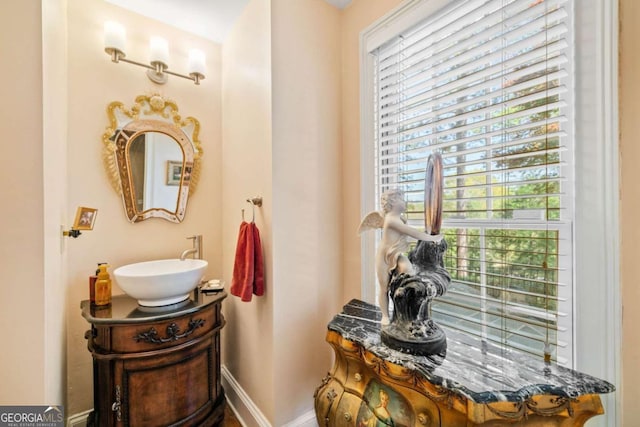 bathroom featuring a sink and baseboards